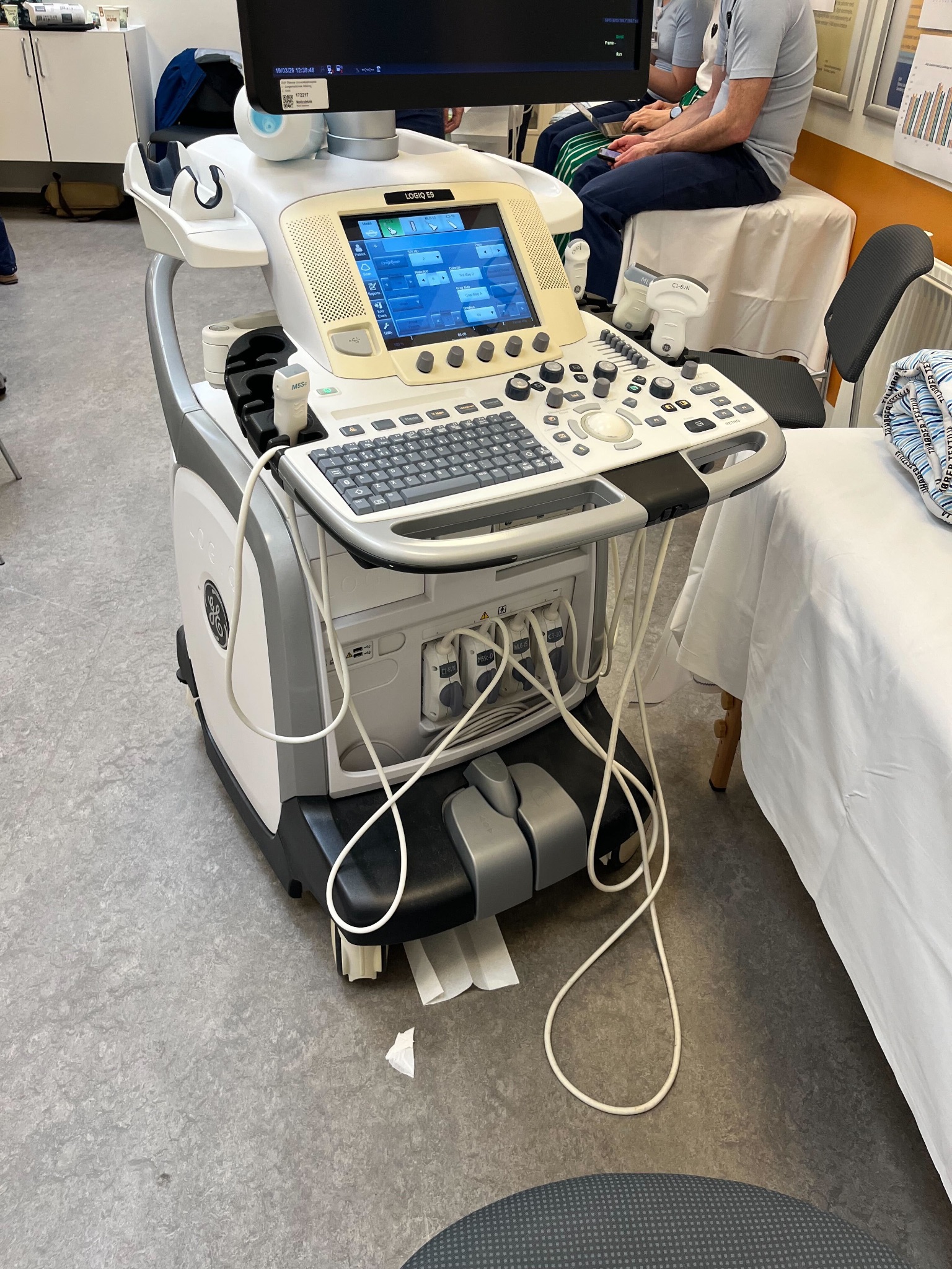 Probe cable draped across the floor during a scan